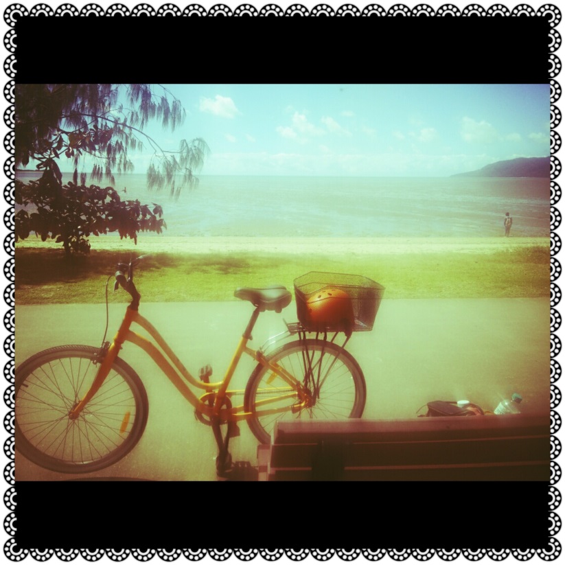 Cycling along Cairns Esplanade